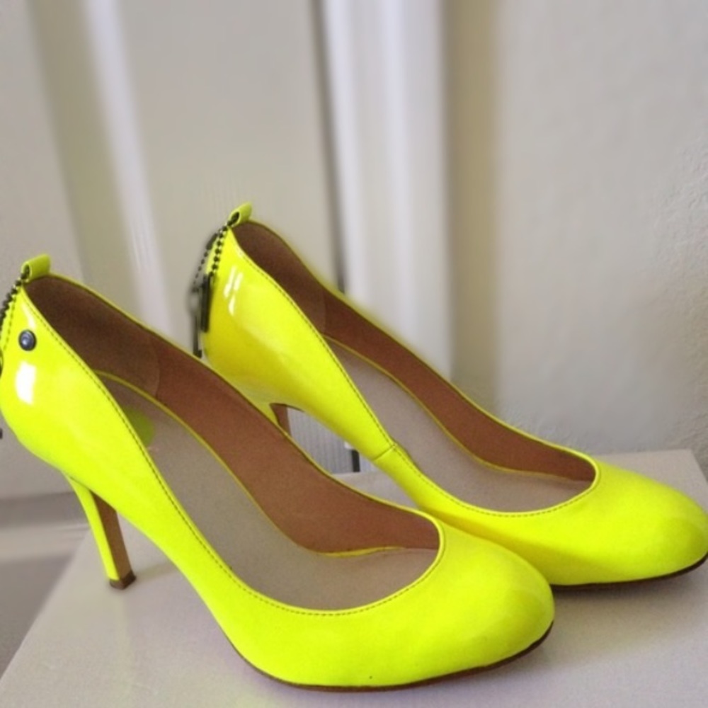 Bright neon yellow heels by Diesel. Adds a pop of color to any outfit!
